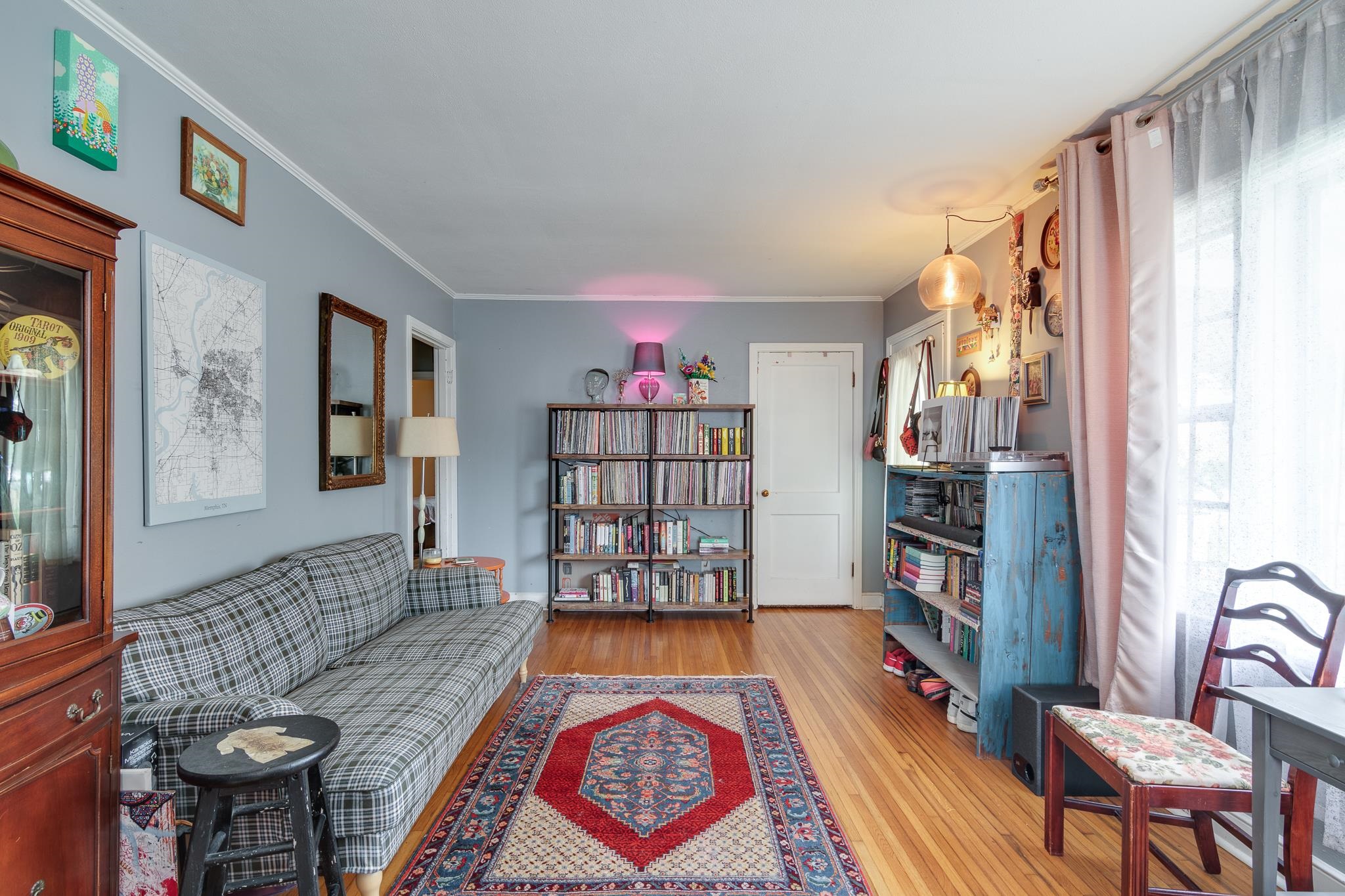 4661 Lynn Road Memphis, TN 38122 - Photo 9 of 32 a living room with furniture a rug and a book shelf