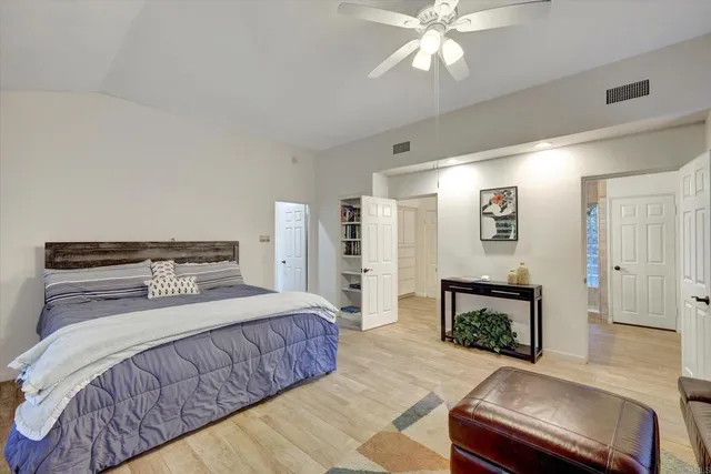 a bathroom with a sink a vanity and a large mirror