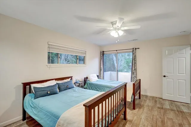 a bathroom with a double vanity sink toilet and shower