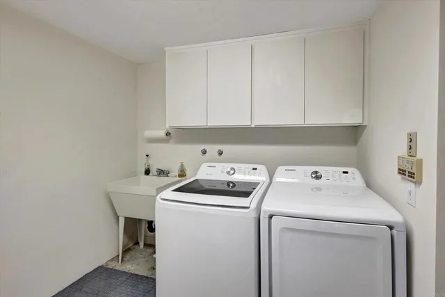 a view of a table and chairs under an umbrella