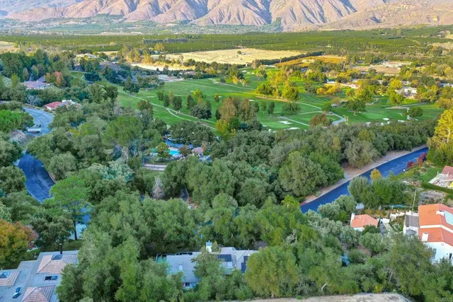 a view of a tennis ground and a houses