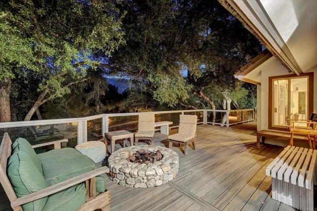 a view of a forest with swimming pool and sitting area