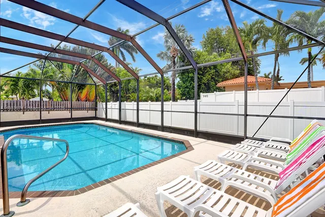 a view of a backyard with a swimming pool