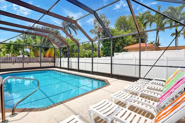 a view of a backyard with a swimming pool