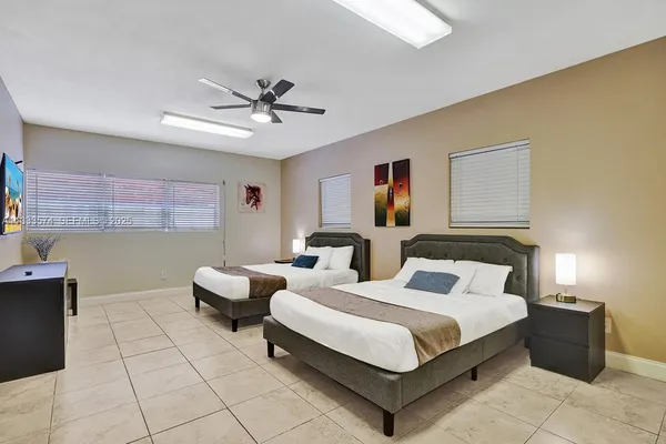 a bedroom with bed and window