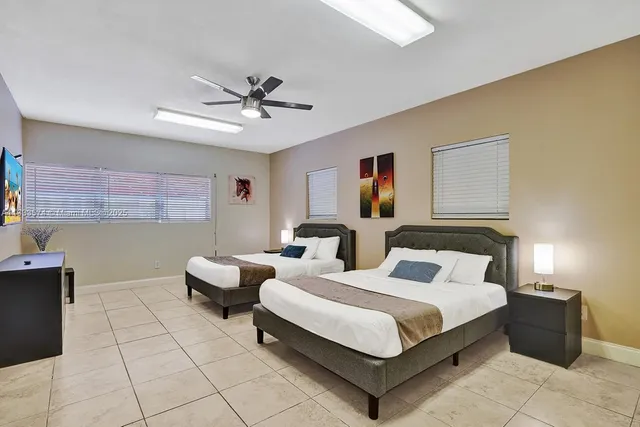 a bedroom with bed and window