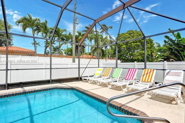 a view of swimming pool with a patio