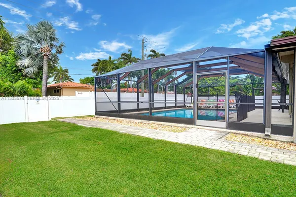 a view of a backyard with a garden and plants
