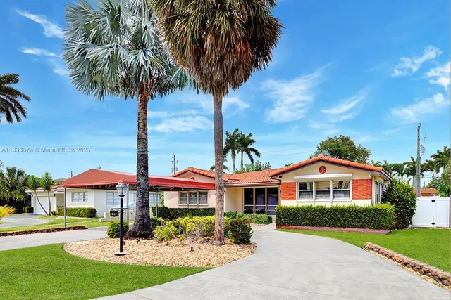 a front view of a house with yard and porch