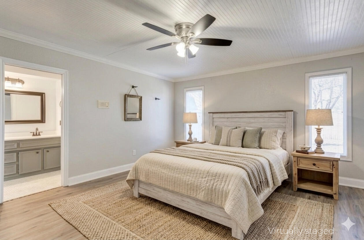5604 70th Street Lubbock, TX 79424 - Photo 12 of 49 a bedroom with a large bed and a chandelier