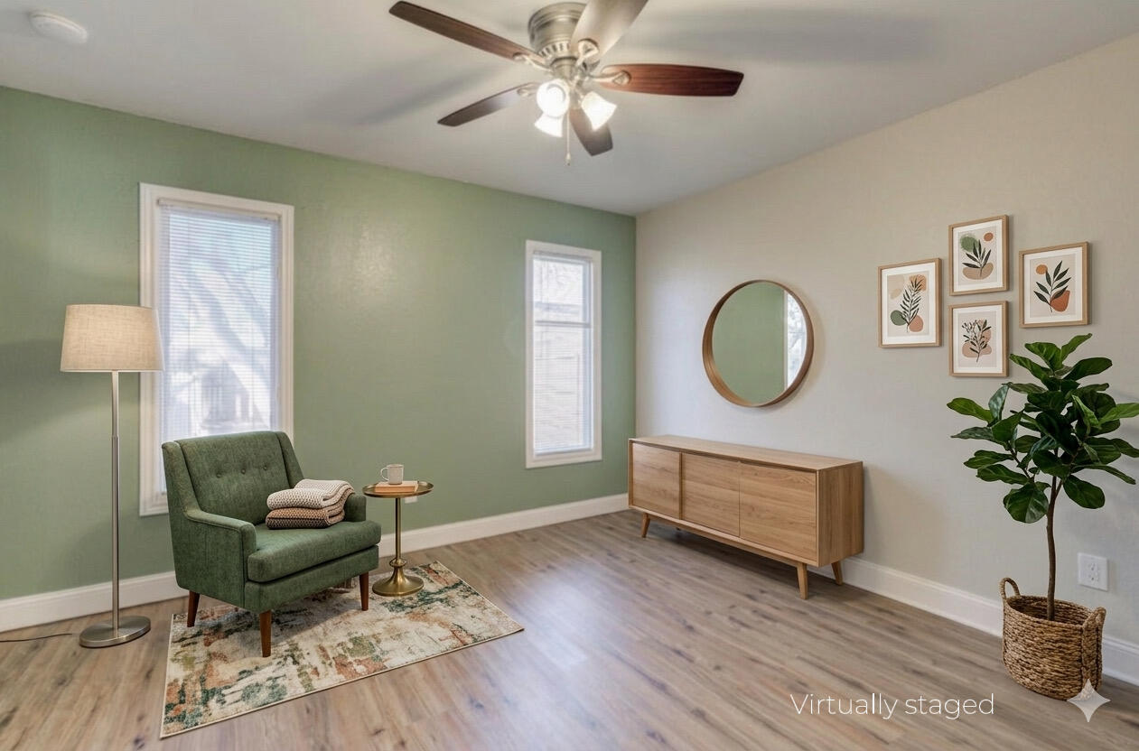 5604 70th Street Lubbock, TX 79424 - Photo 15 of 49 a living room with furniture and a potted plant