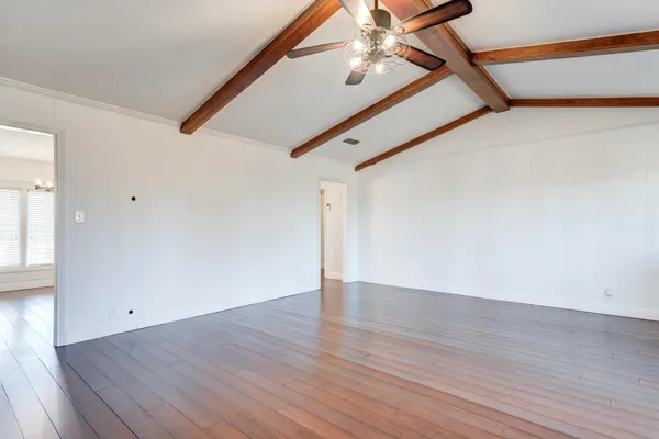 a room with furniture and wooden floor