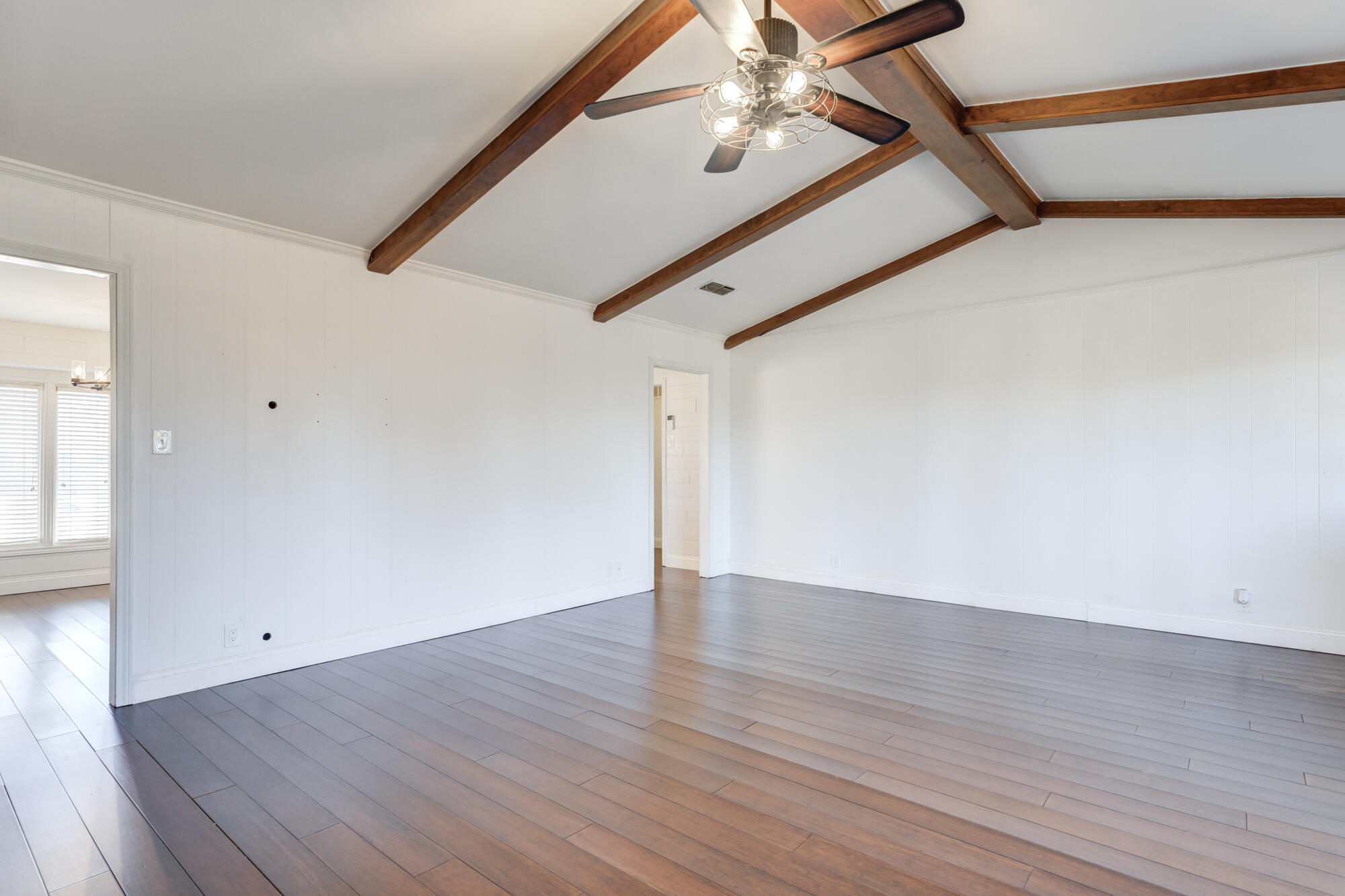 5604 70th Street Lubbock, TX 79424 - Photo 20 of 49 a view of an empty room with wooden floor