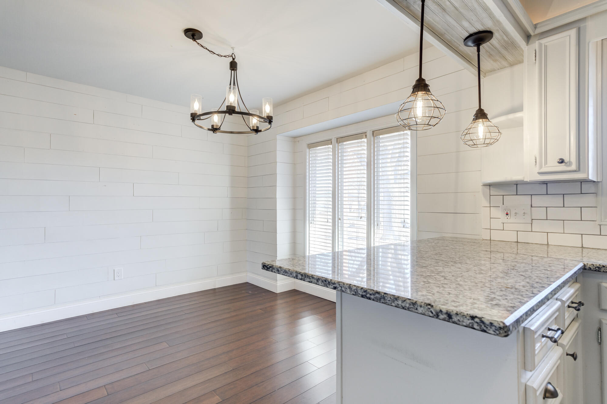 5604 70th Street Lubbock, TX 79424 - Photo 27 of 49 a view of a kitchen with wooden floor and a sink
