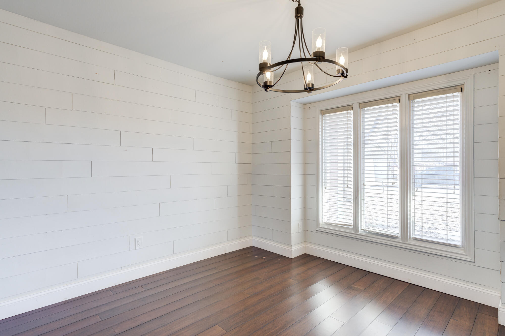 5604 70th Street Lubbock, TX 79424 - Photo 29 of 49 wooden floor in an empty room with a window