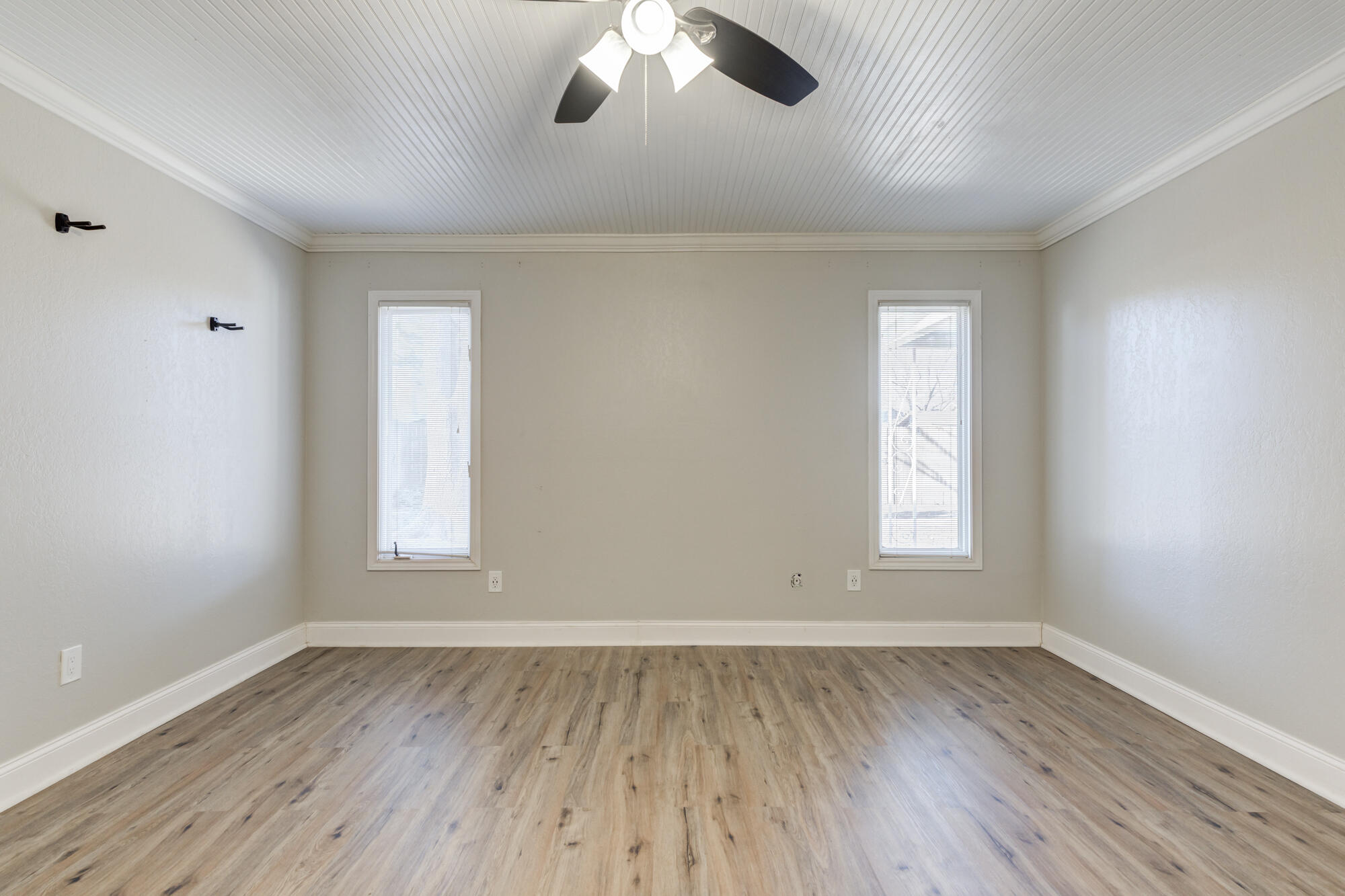 5604 70th Street Lubbock, TX 79424 - Photo 34 of 49 wooden floor in an empty room with a window