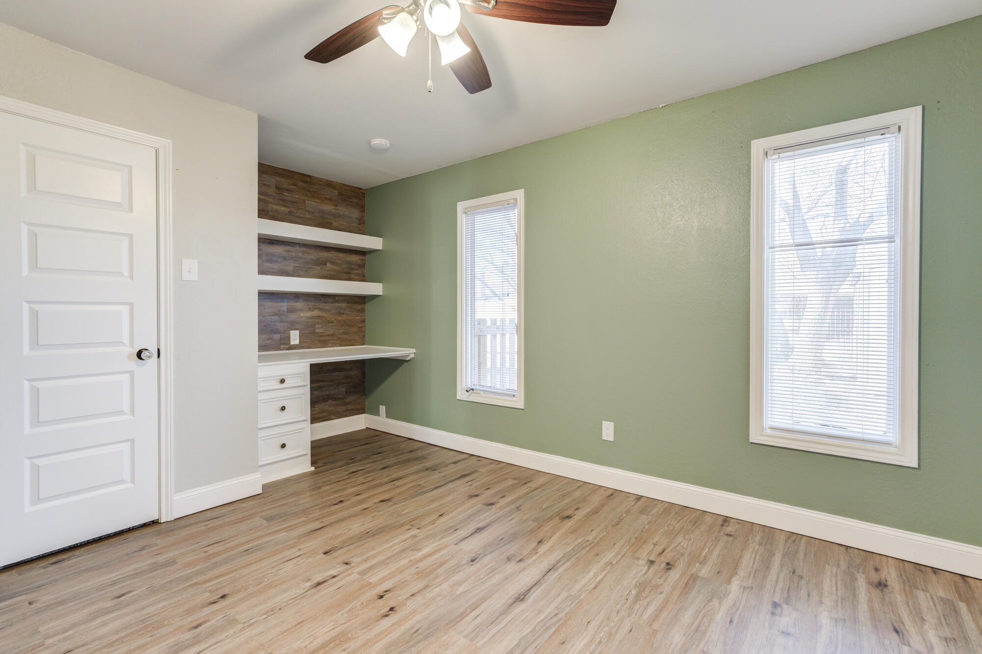 5604 70th Street Lubbock, TX 79424 - Photo 39 of 49 wooden floor in an empty room with a window
