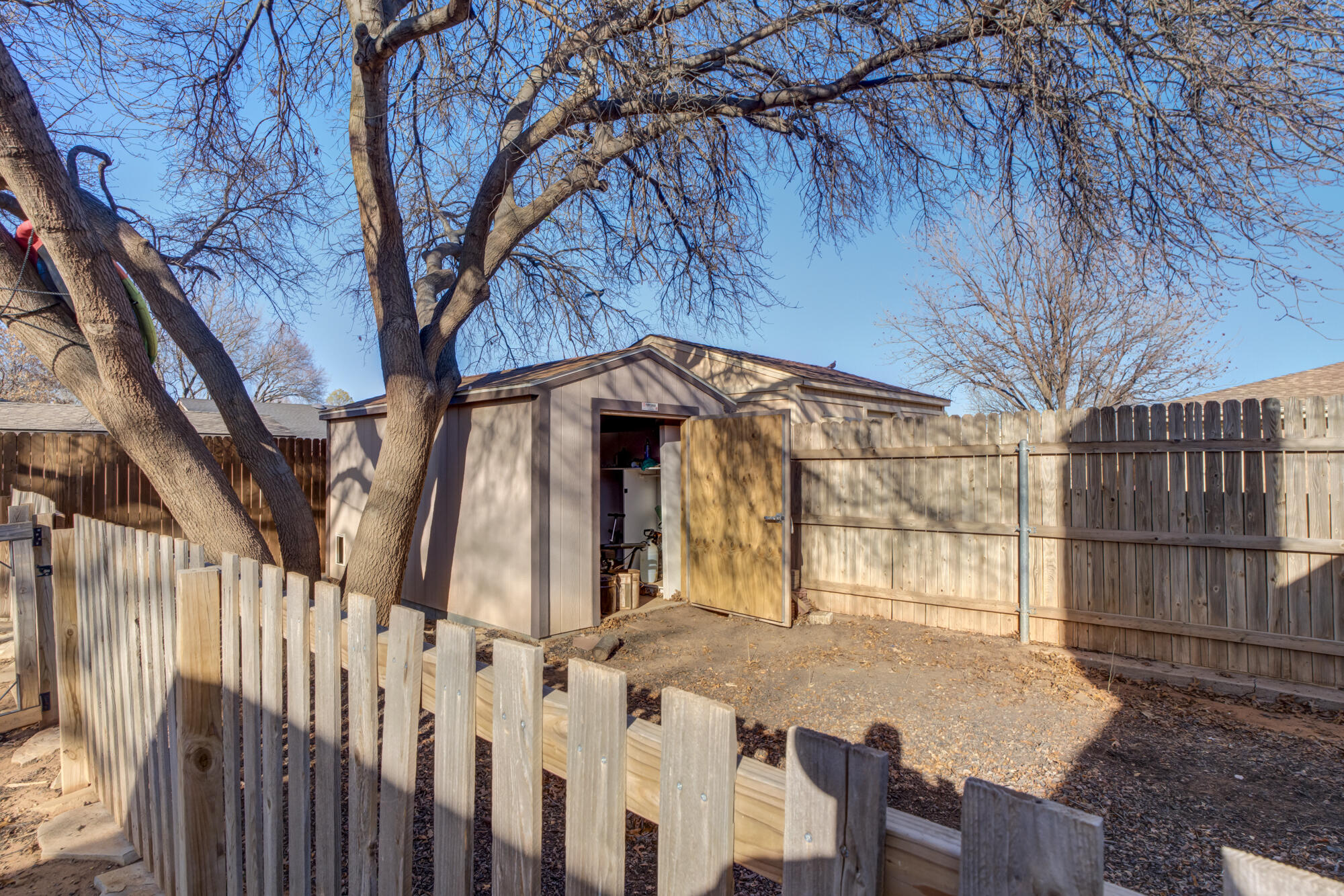 5604 70th Street Lubbock, TX 79424 - Photo 47 of 49 a view of a house with a wooden fence