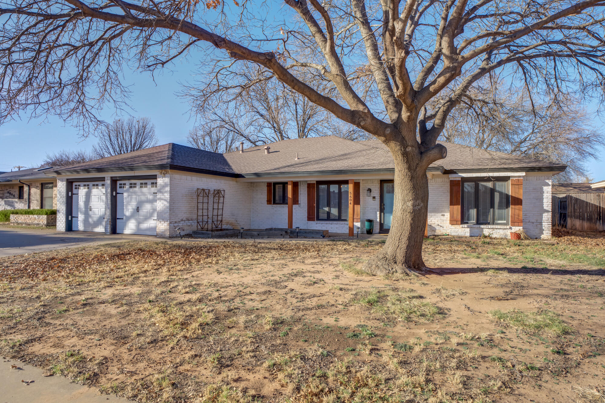 5604 70th Street Lubbock, TX 79424 - Photo 49 of 49 a front view of a house with a yard