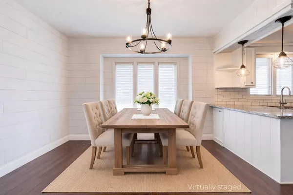a very nice looking room with wooden floor and a window