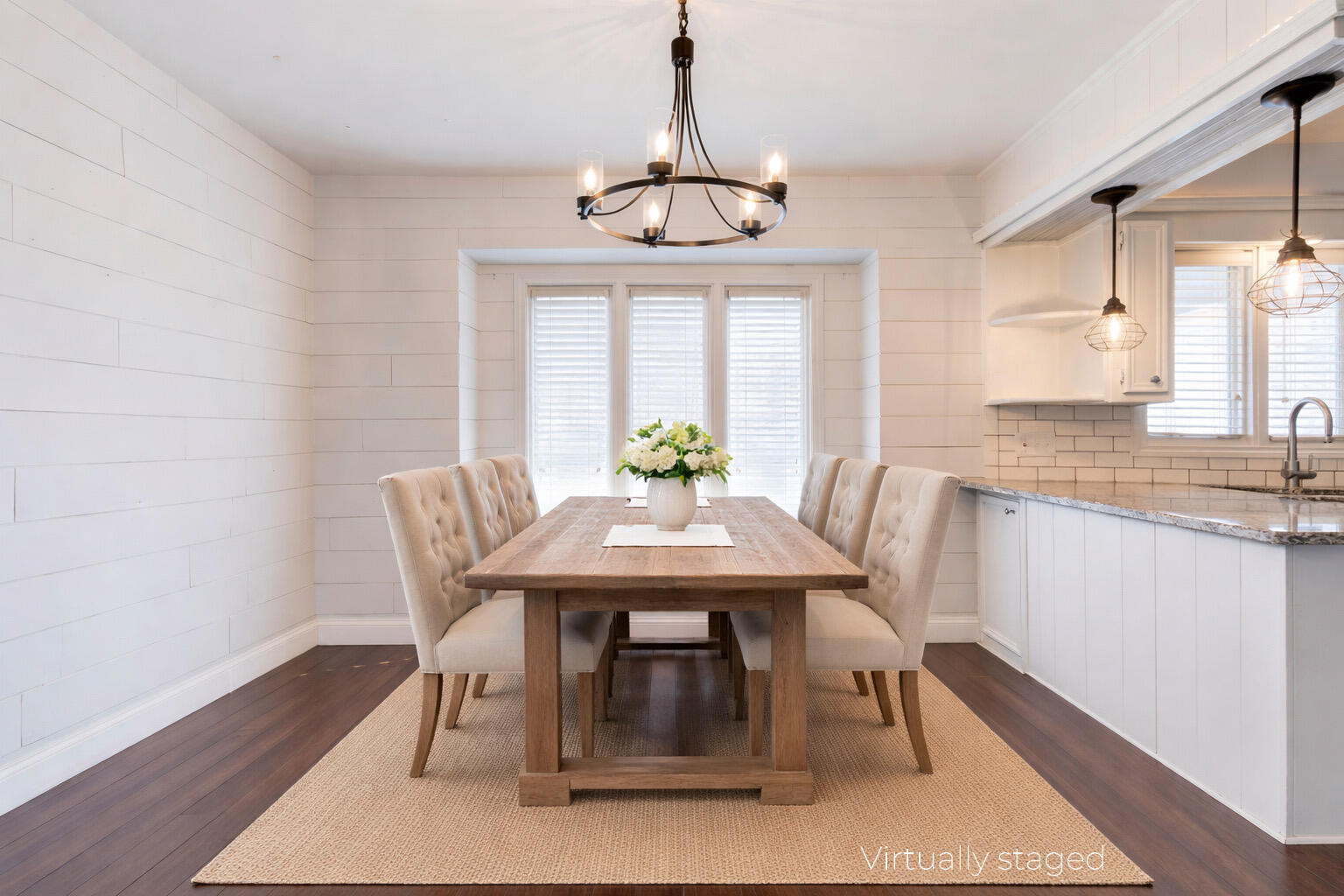 5604 70th Street Lubbock, TX 79424 - Photo 6 of 49 a dining room with furniture a chandelier and wooden floor