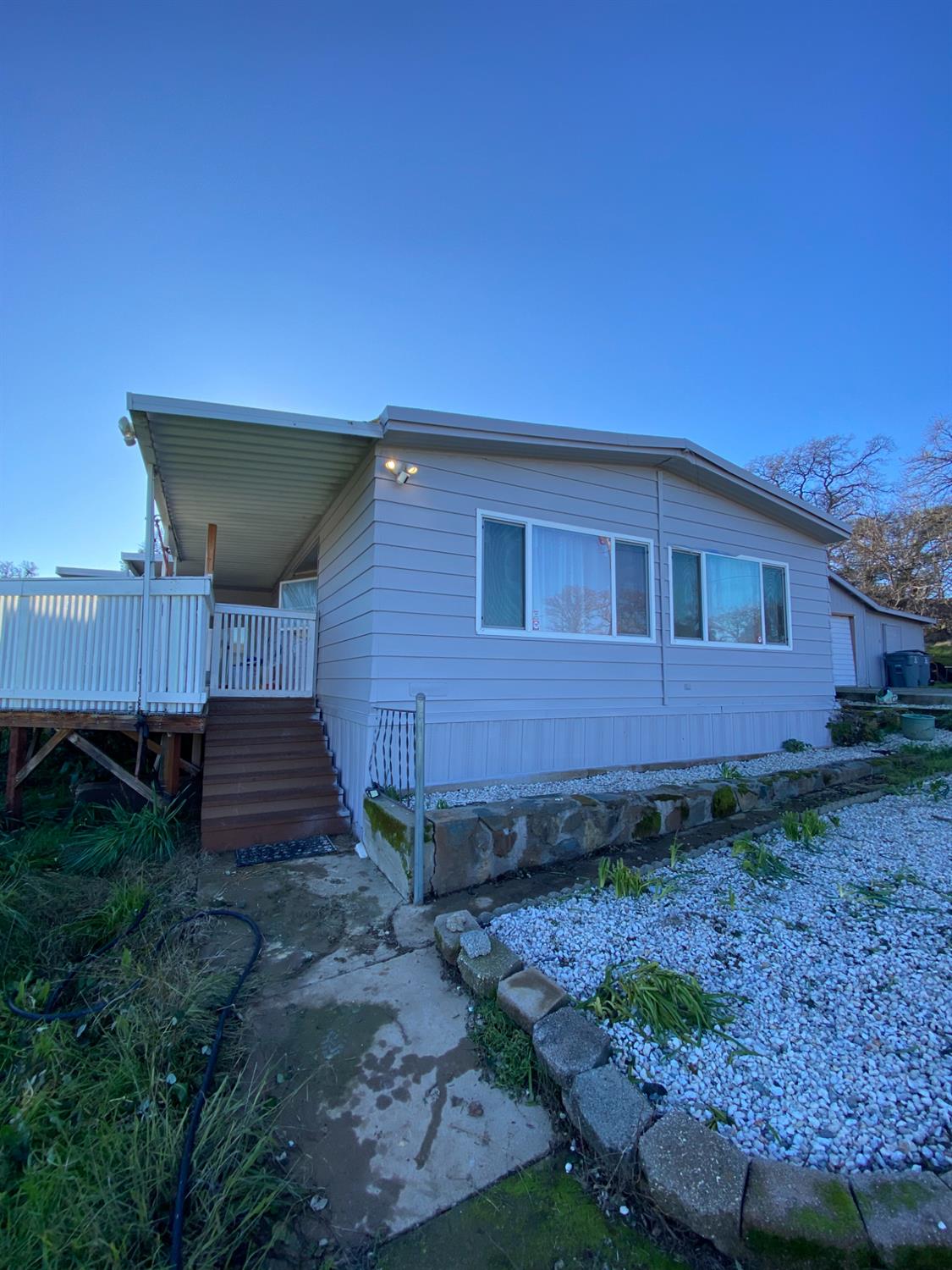12287 Loma Rica Road Marysville, CA 95901 - Photo 2 of 3 a view of a backyard with plants and large tree