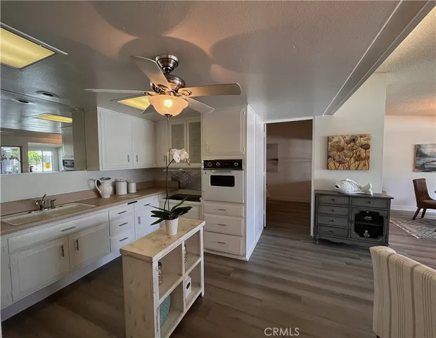 a kitchen with a stove a sink and a refrigerator