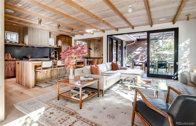 a living room with lots of furniture and a chandelier