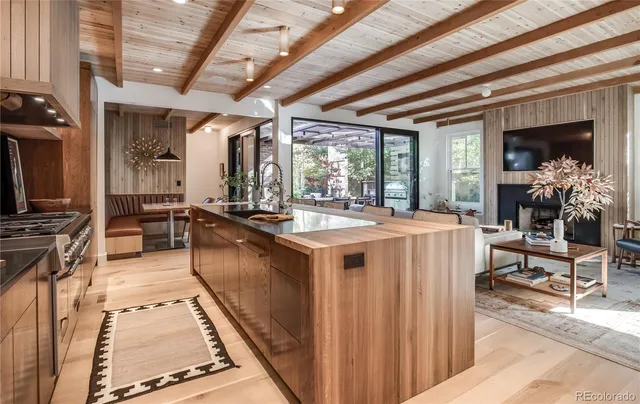 a large white kitchen with a large window
