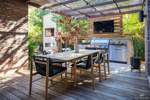 a view of a dining table and chairs in the patio