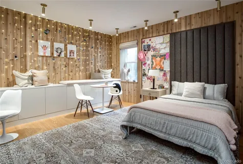 a bedroom with a bed and a table