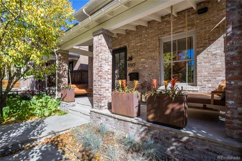 a view of living room filled with furniture and a potted plant