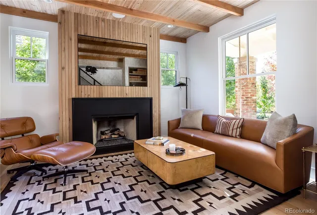 a living room with a couch and a fireplace