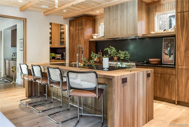 a kitchen with table and chairs