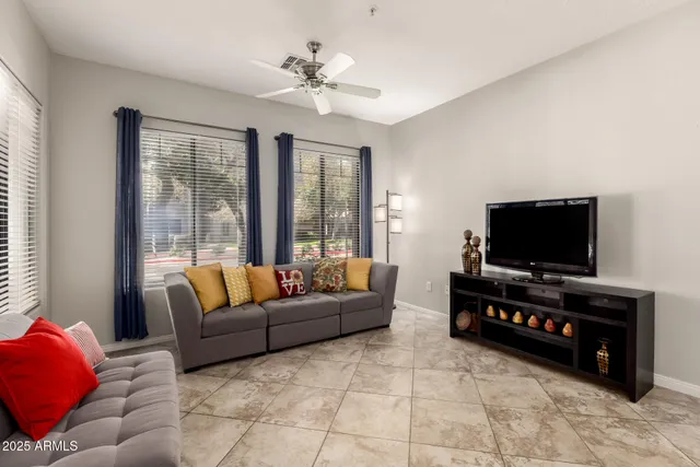 a view of a livingroom with furniture and a flat screen tv
