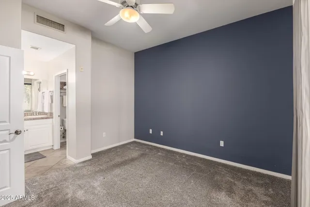 a bathroom with a shower a toilet and sink