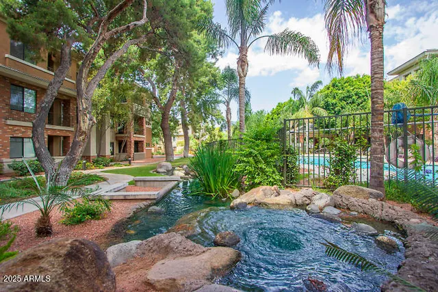 a swimming pool with outdoor seating and yard
