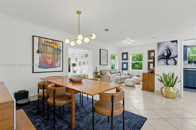 a dining room with furniture a livingroom and chandelier