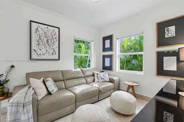 a living room with furniture and a large window