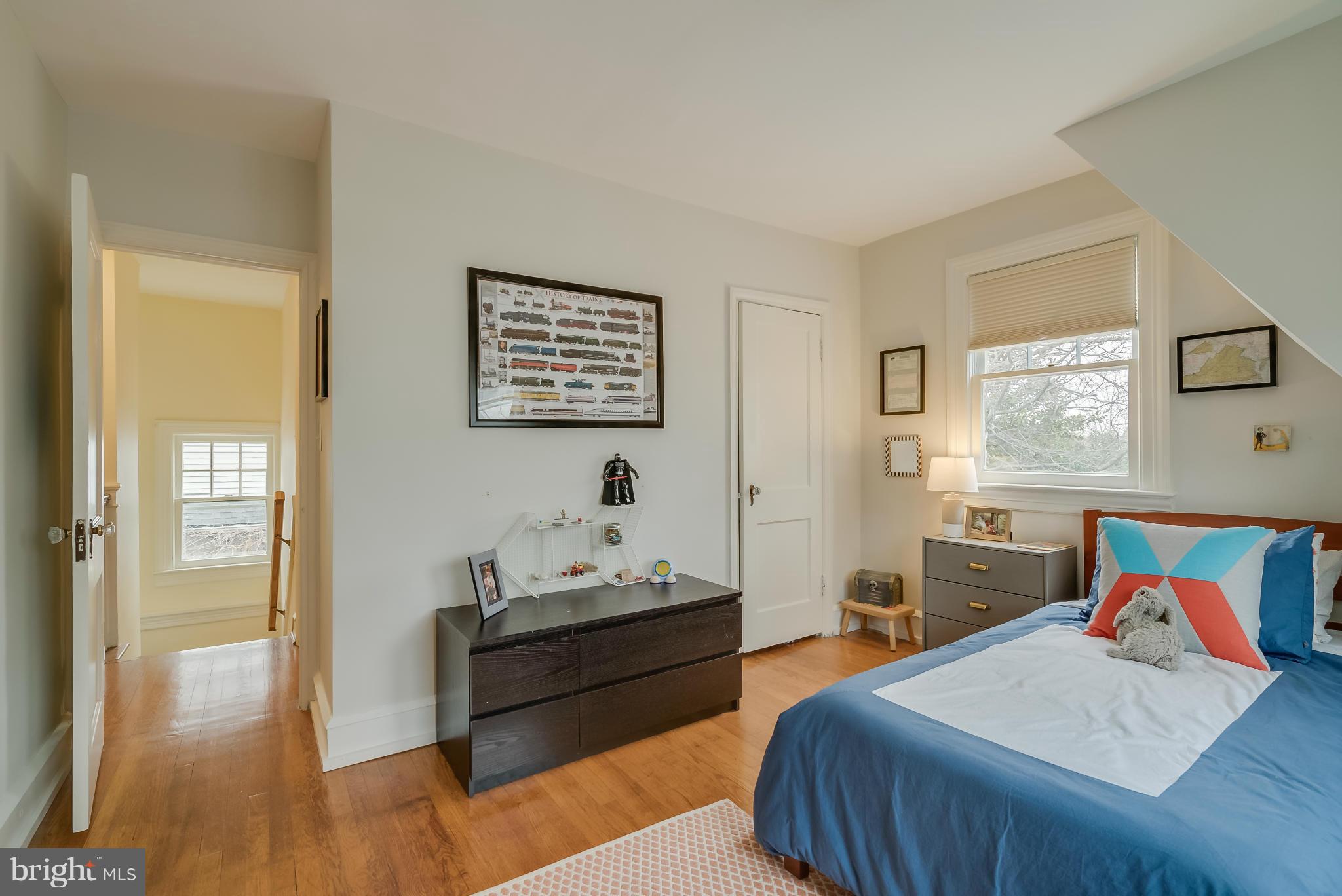 1409 Russell Road Alexandria, VA 22301 - Photo 22 of 30 a bedroom with a bed and wooden floor