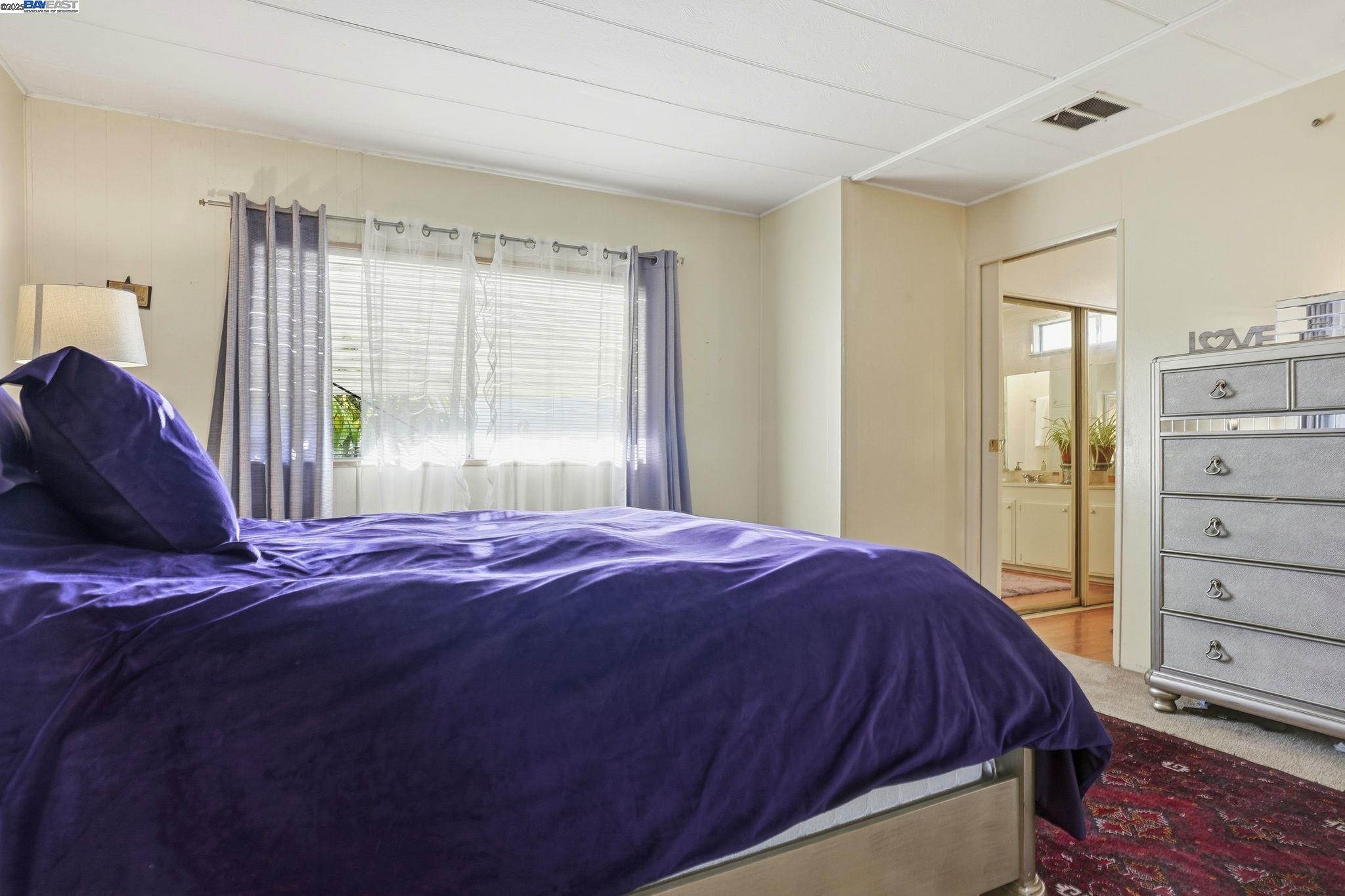 4141 Deep Creek Road, Unit 89 Fremont, CA 94555 - Photo 28 of 54 a bedroom with a bed and a window