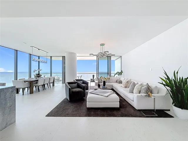a view of a livingroom with furniture and windows