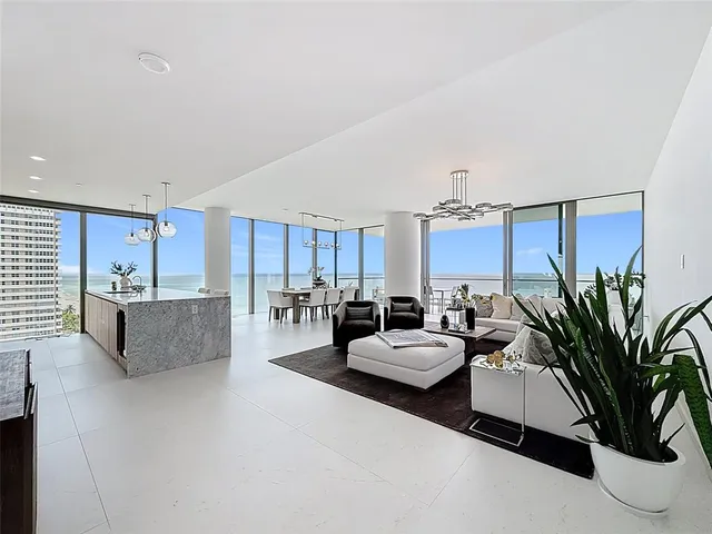 a view of a livingroom with furniture and a flat screen tv