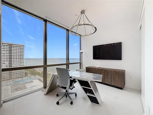 a large bathroom with a large tub and sink