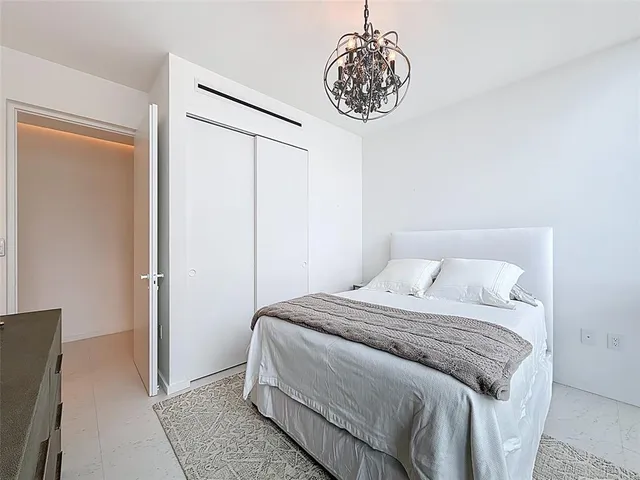 a bathroom with a tub a sink shower and a mirror