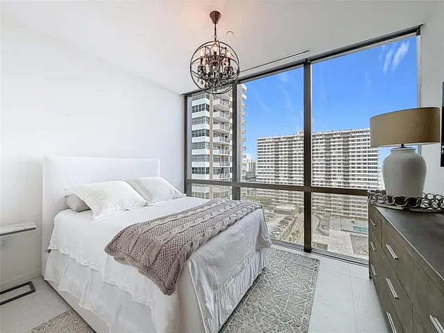 a view of walk in closet with clothes