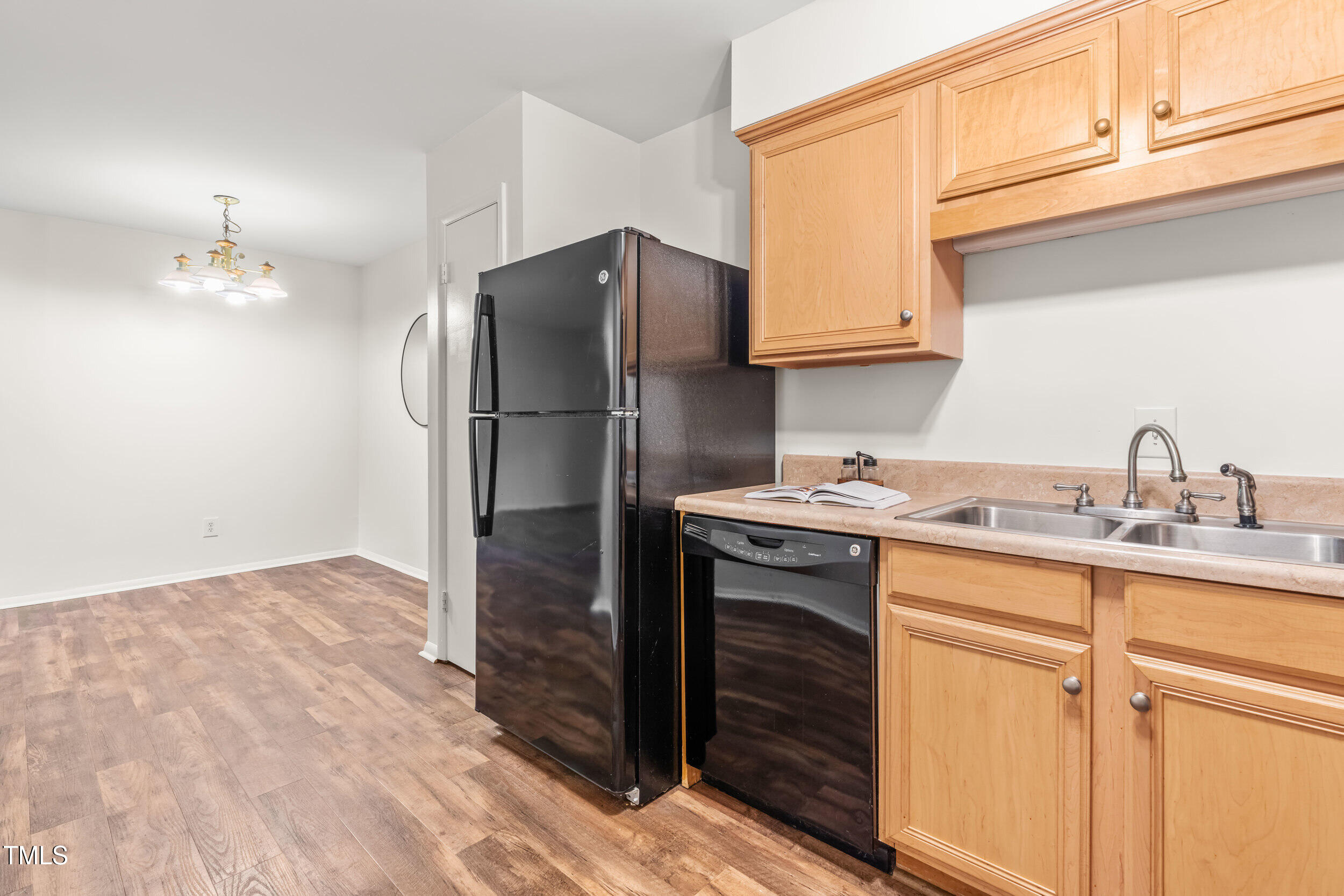 1212 Schaub Drive, Unit C Raleigh, NC 27606 - Photo 17 of 23 a kitchen with a sink cabinets and stainless steel appliances