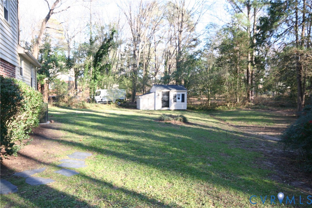 12141 Old Buckingham Road Midlothian, VA 23113 - Photo 36 of 39 Spacious grassy yard featuring a detached storage
