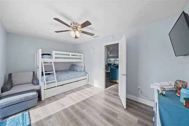 a room with wooden floor and furniture