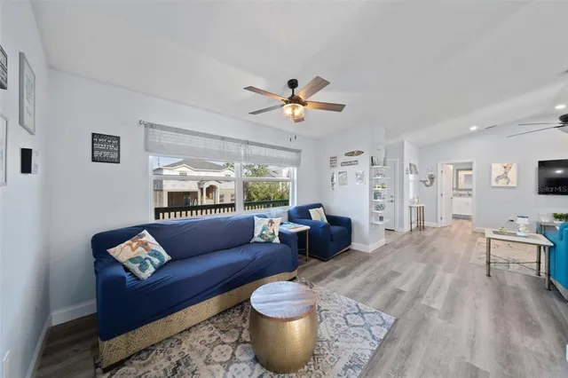 a living room with furniture and a rug